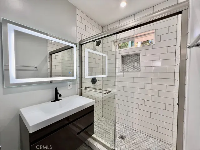 a bathroom with a sink and a mirror
