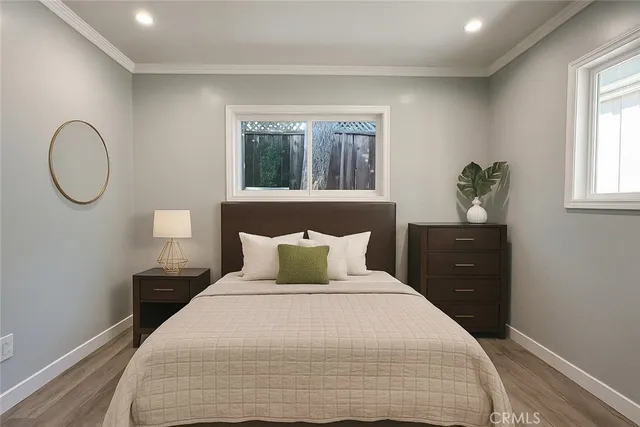 a bedroom with a bed and window