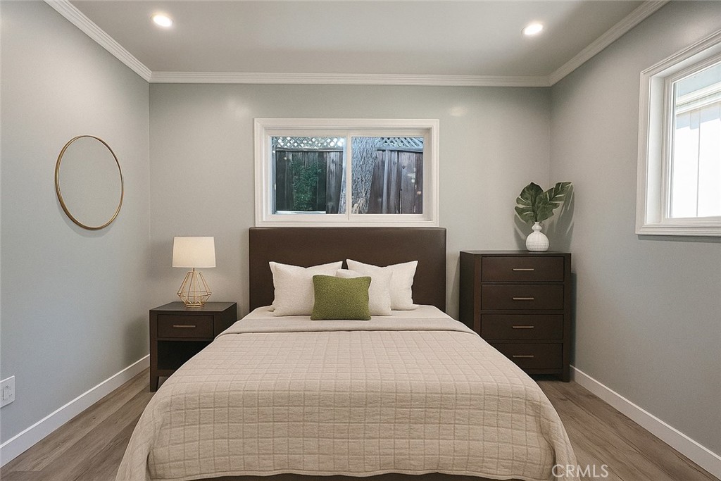 457 Seaward Road, Unit B Newport Beach, CA 92625 - Photo 7 of 16 a bedroom with a bed and window