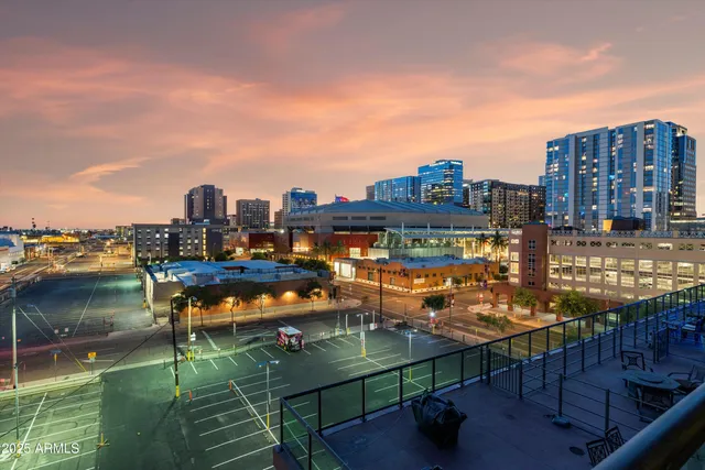 a terrace with outdoor seating and city view