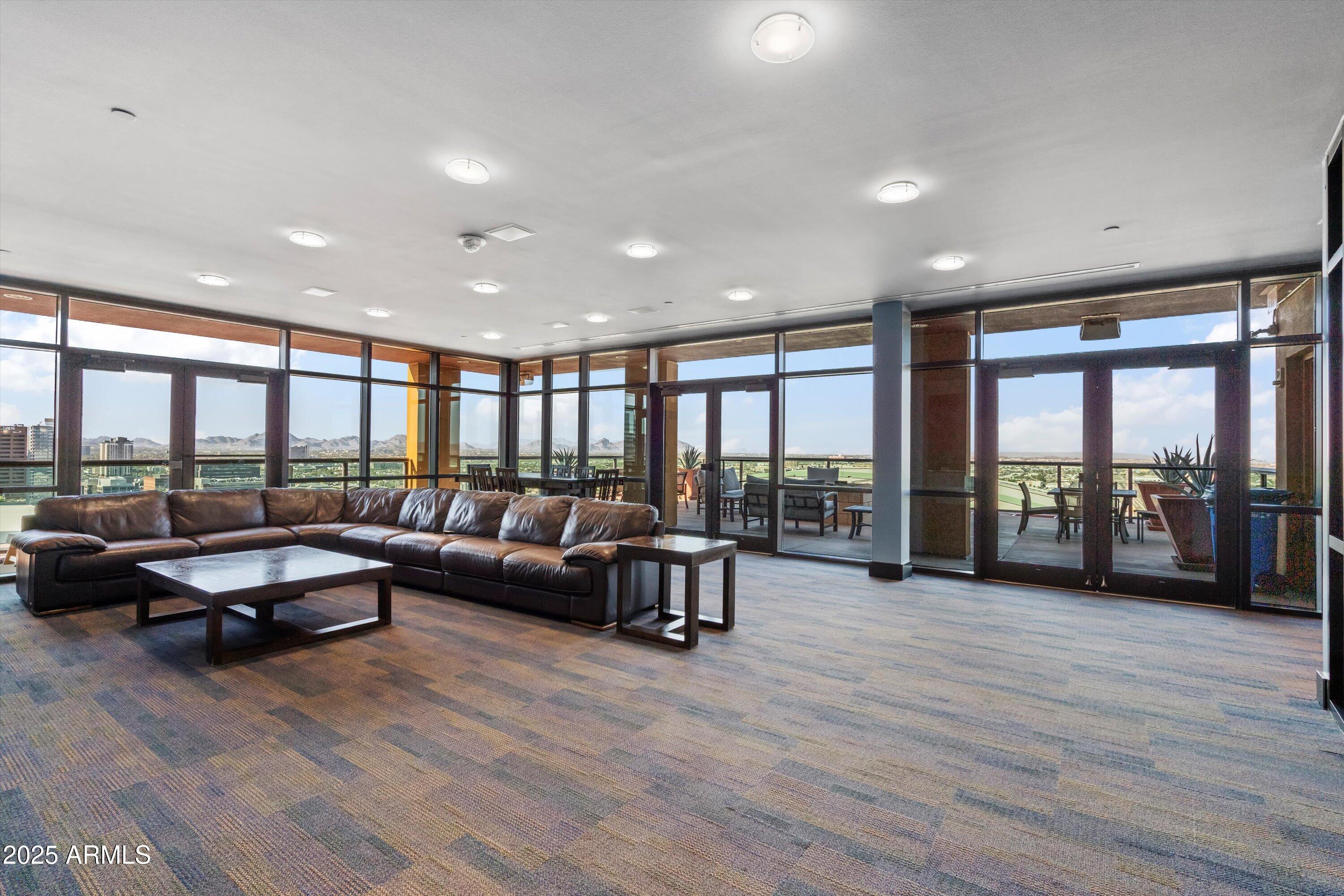 310 South 4th Street, Unit 601 Phoenix, AZ 85004 - Photo 30 of 32 a living room with furniture and large windows
