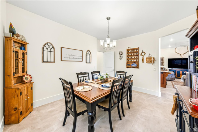 357 East Main Street Enterprise, UT 84725 - Photo 22 of 71 Dining area featuring a chandelier and baseboards