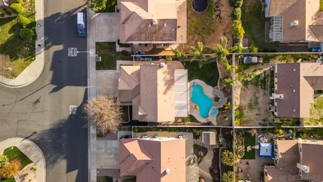 an aerial view of residential houses with outdoor space