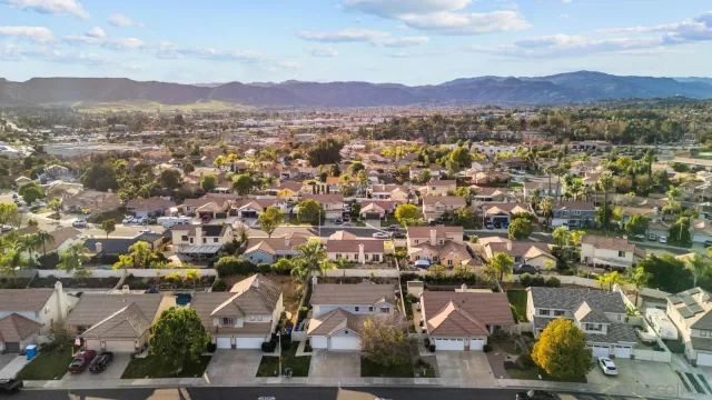 an aerial view of residential houses and outdoor space