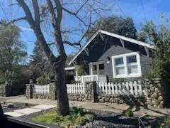 a front view of a house with yard