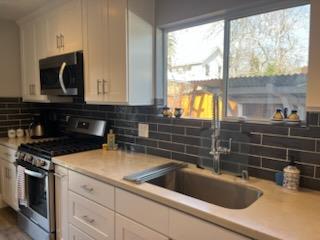 1437 4th Street Calistoga, CA 94515 - Photo 3 of 15 a kitchen with a sink a stove and cabinets
