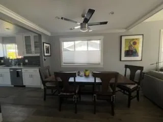 a dining room with furniture and window
