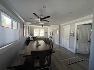 a view of a dining room with furniture and window