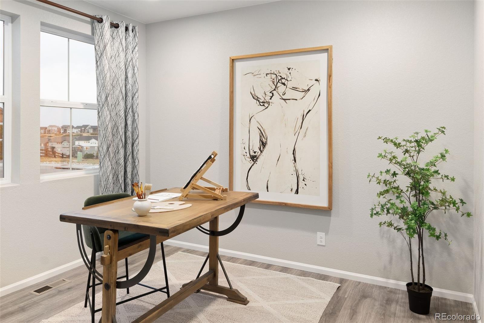 3957 Breakcamp Court Castle Rock, CO 80108 - Photo 22 of 50 a view of a workspace with furniture and a potted plant