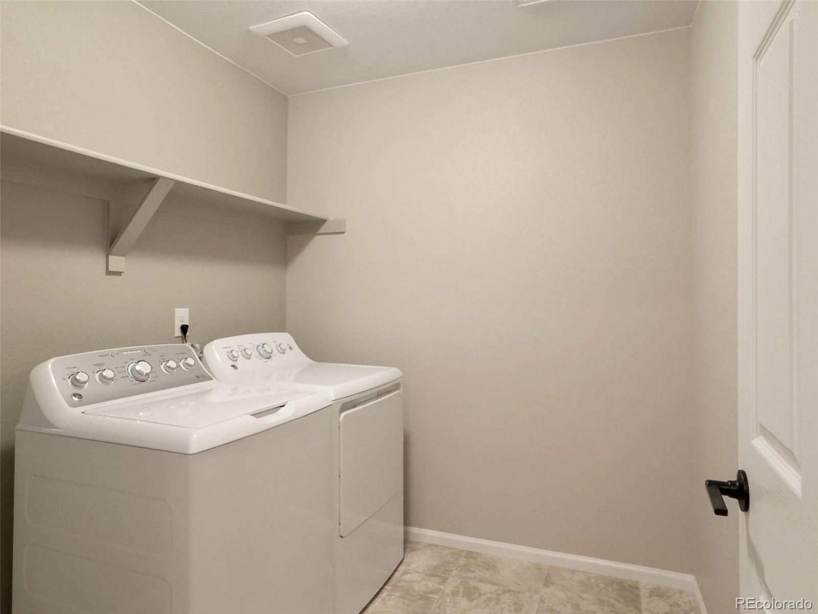 3957 Breakcamp Court Castle Rock, CO 80108 - Photo 29 of 50 a utility room with dryer and washer
