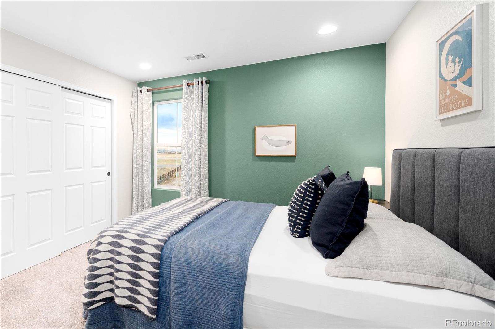 3957 Breakcamp Court Castle Rock, CO 80108 - Photo 39 of 50 a bedroom with a large bed and a window