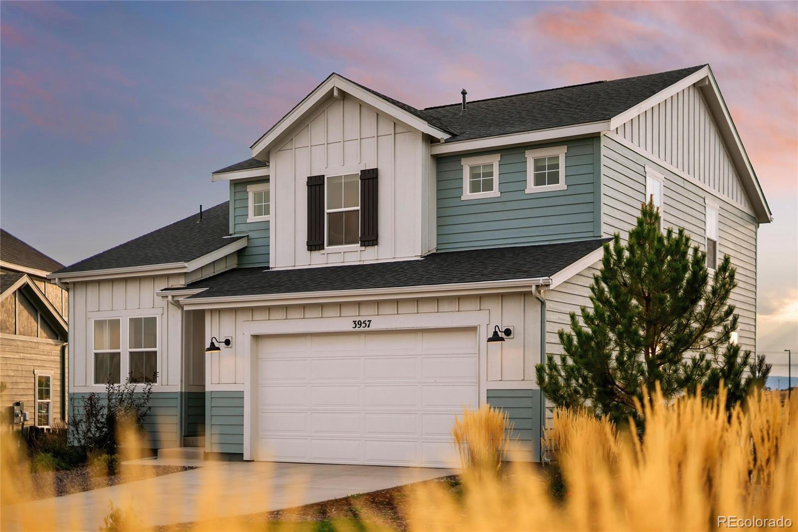 3957 Breakcamp Court Castle Rock, CO 80108 - Photo 4 of 50 a front view of a house with a yard