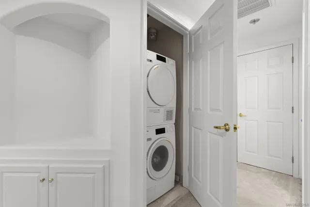 a living room with fireplace furniture and a large window