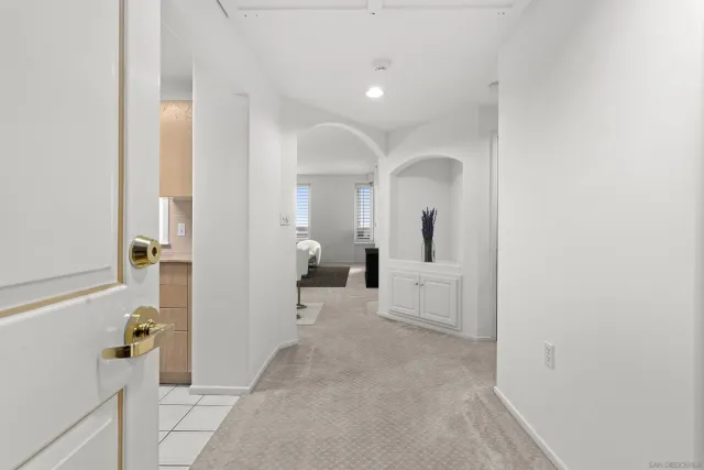 a living room with furniture a rug and a flat screen tv