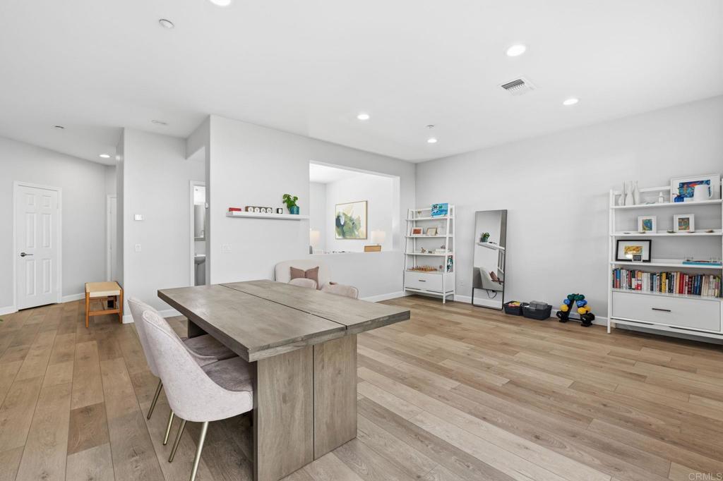 6485 Alexandri Circle Carlsbad, CA 92011 - Photo 13 of 40 a view of a kitchen with furniture and wooden floor