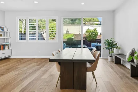 a dining room with a table and chairs