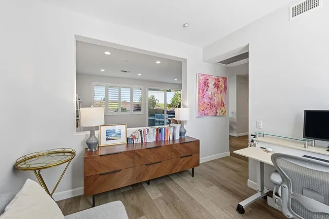 a work room with furniture and wooden floor