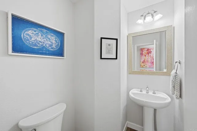 a bathroom with a toilet and a sink
