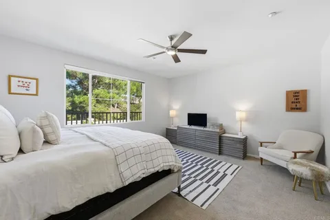 a bedroom with a bed and a couch