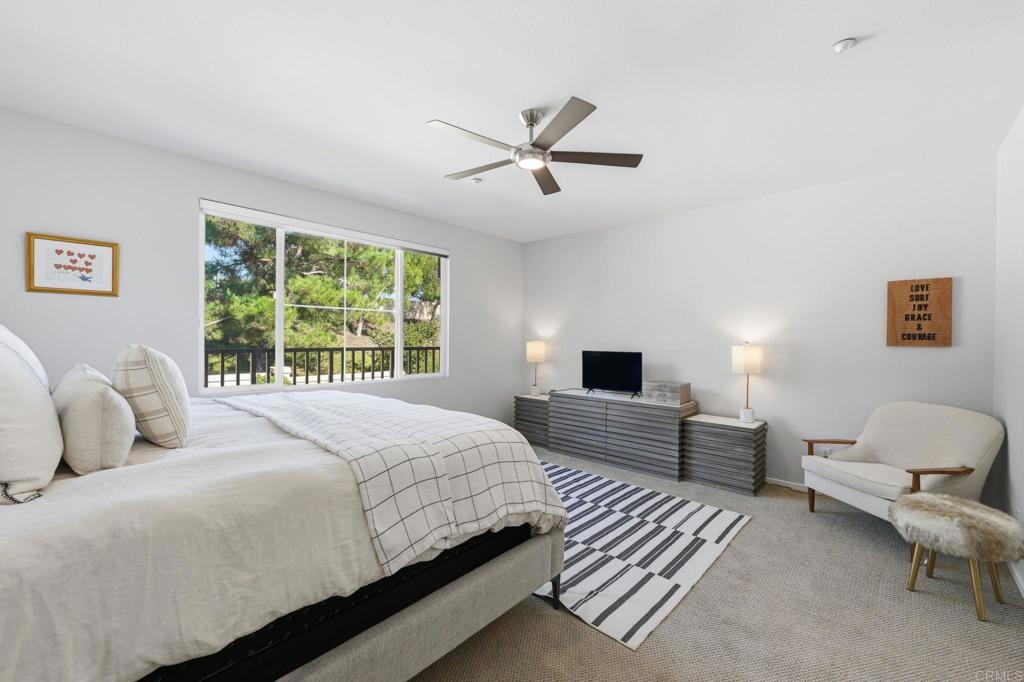 6485 Alexandri Circle Carlsbad, CA 92011 - Photo 18 of 40 a bedroom with a bed and a couch