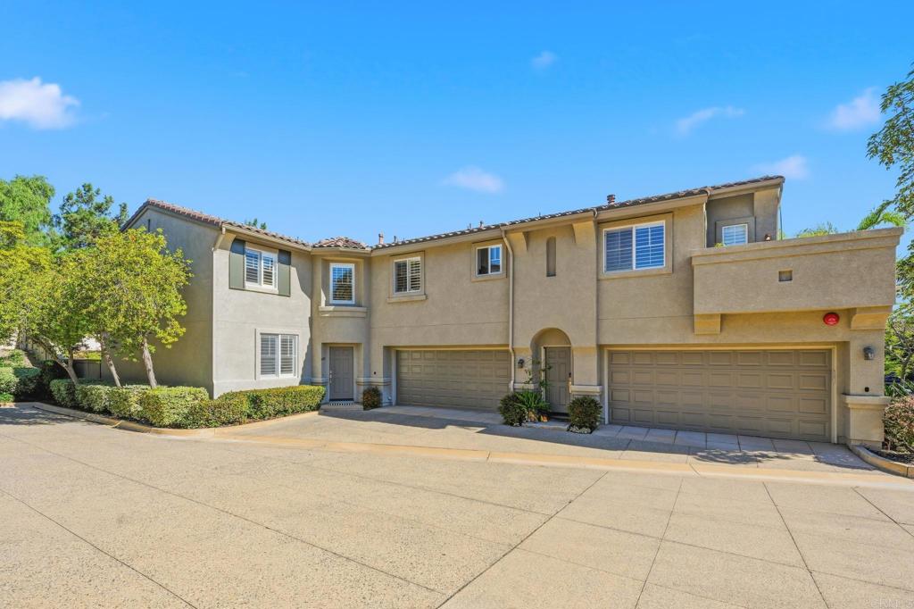 6485 Alexandri Circle Carlsbad, CA 92011 - Photo 2 of 40 a front view of a house with a yard and garage