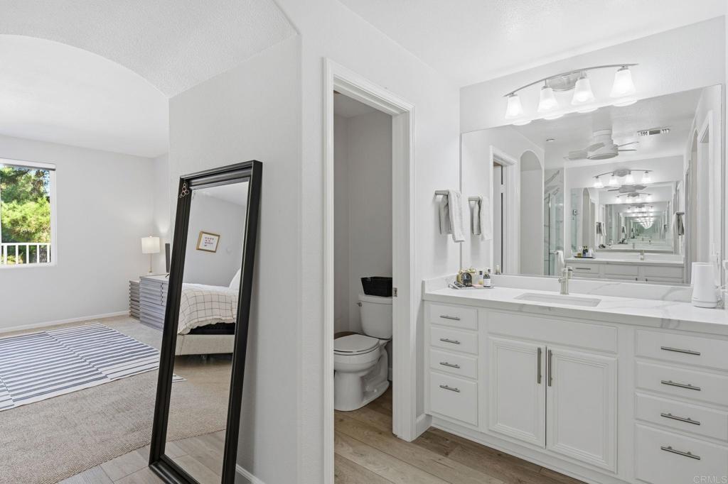 6485 Alexandri Circle Carlsbad, CA 92011 - Photo 23 of 40 a bathroom with a double vanity sink and a mirror