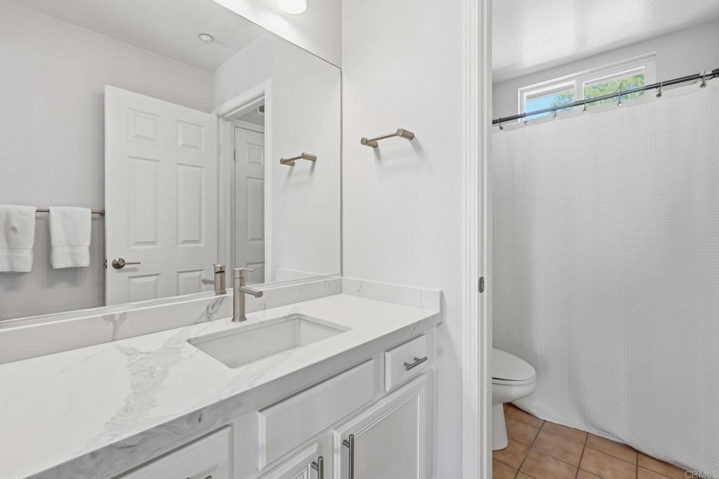 6485 Alexandri Circle Carlsbad, CA 92011 - Photo 25 of 40 a bathroom with a sink and a mirror