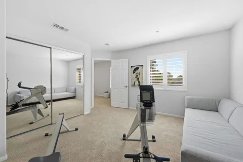 a view of a livingroom with furniture and a window
