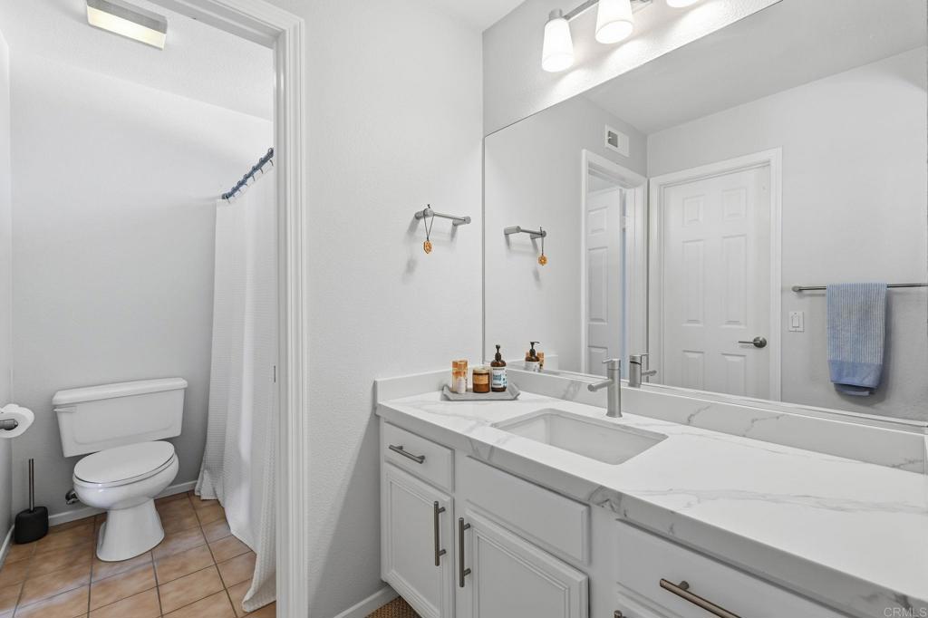 6485 Alexandri Circle Carlsbad, CA 92011 - Photo 27 of 40 a bathroom with a sink toilet and shower