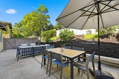 a view of an outdoor sitting area with furniture