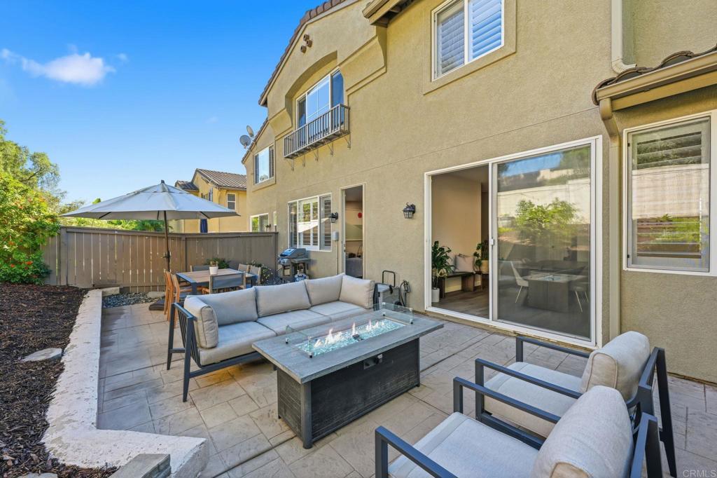 6485 Alexandri Circle Carlsbad, CA 92011 - Photo 30 of 40 a outdoor space with patio the couches and a potted plant on the table