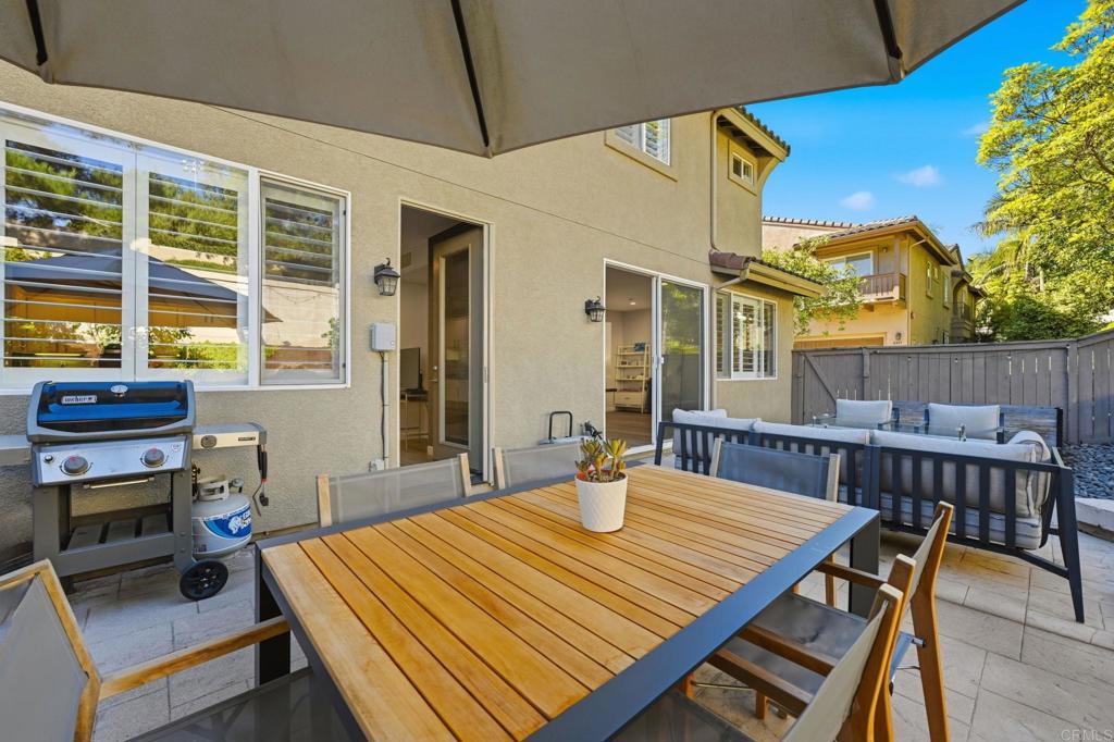 6485 Alexandri Circle Carlsbad, CA 92011 - Photo 31 of 40 a outdoor dining space with furniture and wooden floor