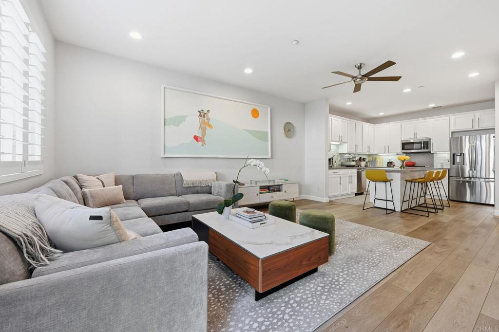 6485 Alexandri Circle Carlsbad, CA 92011 - Photo 9 of 40 a living room with furniture and kitchen view