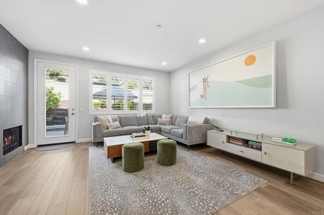 a room with furniture wooden floor and window
