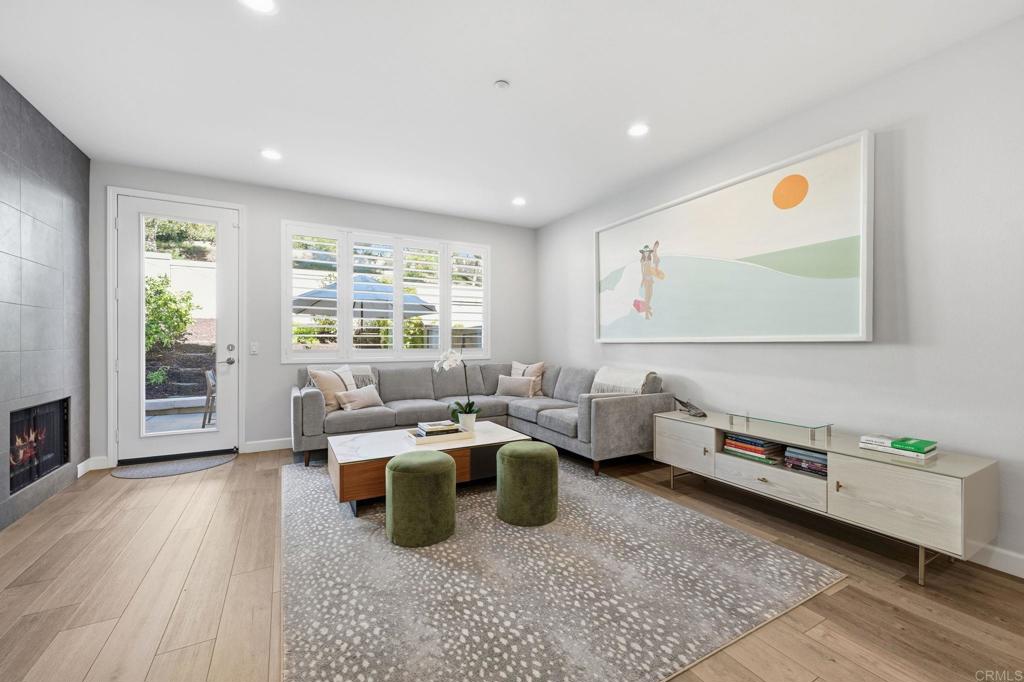 6485 Alexandri Circle Carlsbad, CA 92011 - Photo 10 of 40 a room with furniture wooden floor and window