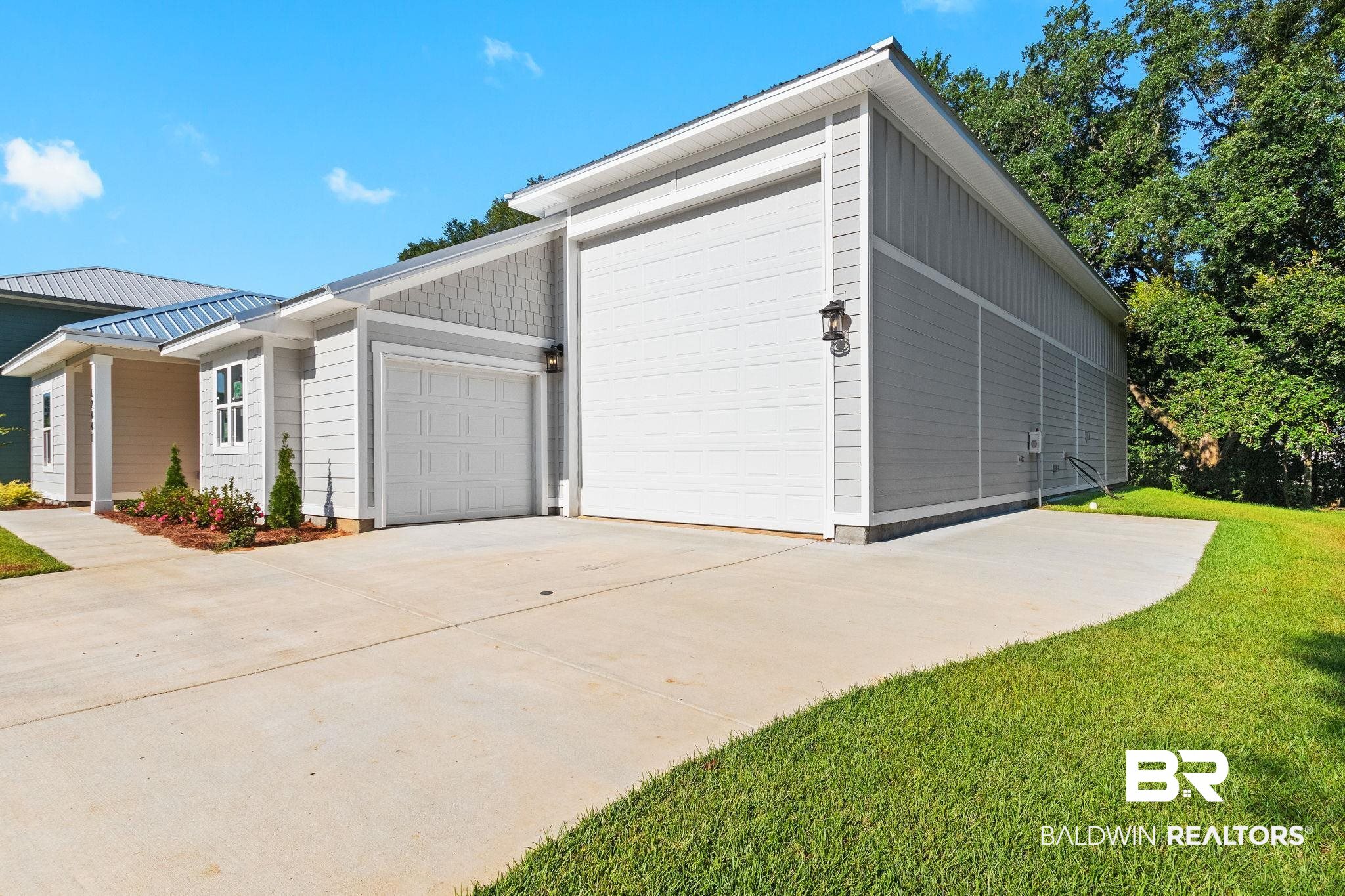 12441 Reunion Place Foley, AL 36535 - Photo 3 of 31 Garage with a lawn