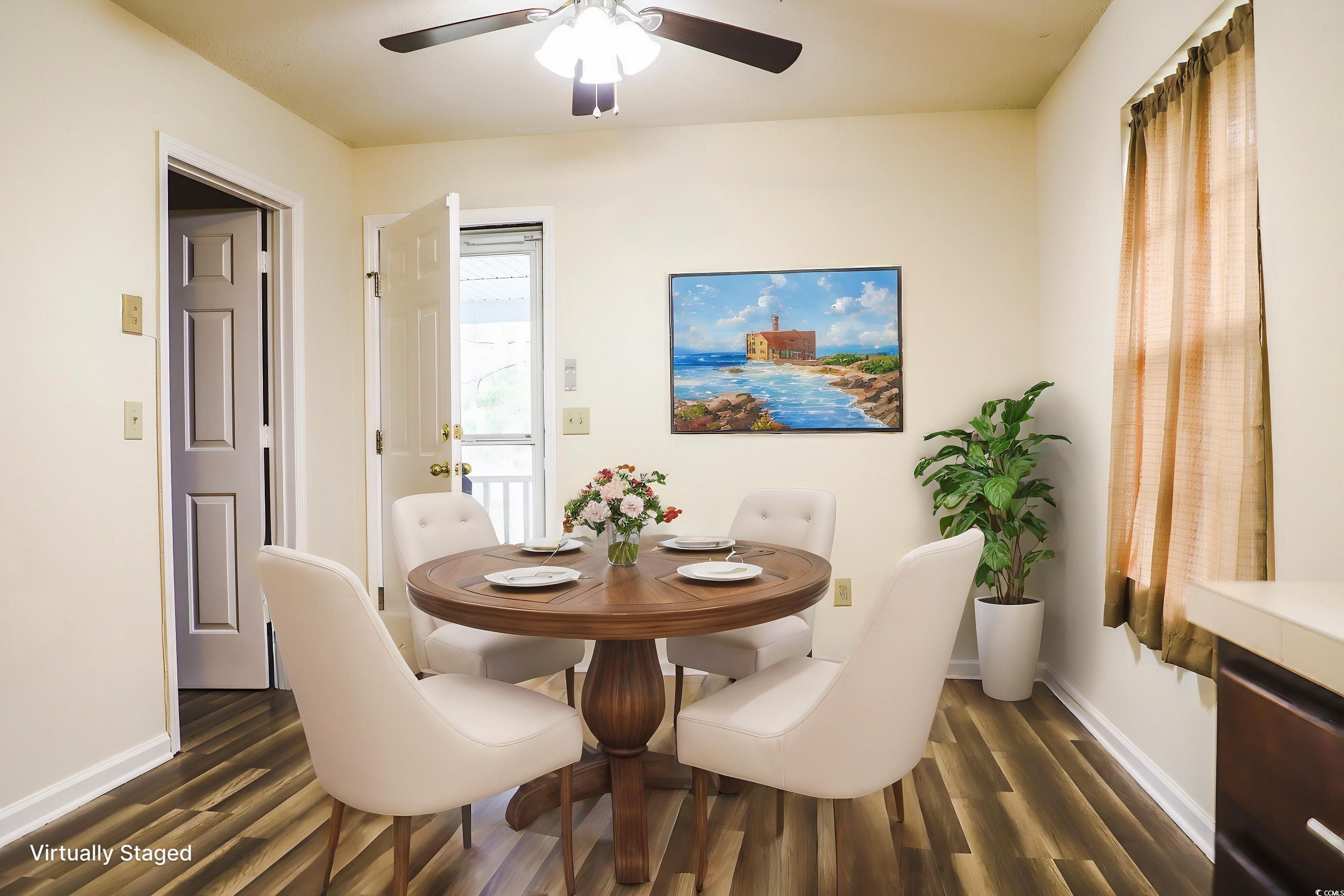 3285 Della Road Longs, SC 29568 - Photo 8 of 23 Dining room with a ceiling fan, baseboards, and dark wood-style flooring