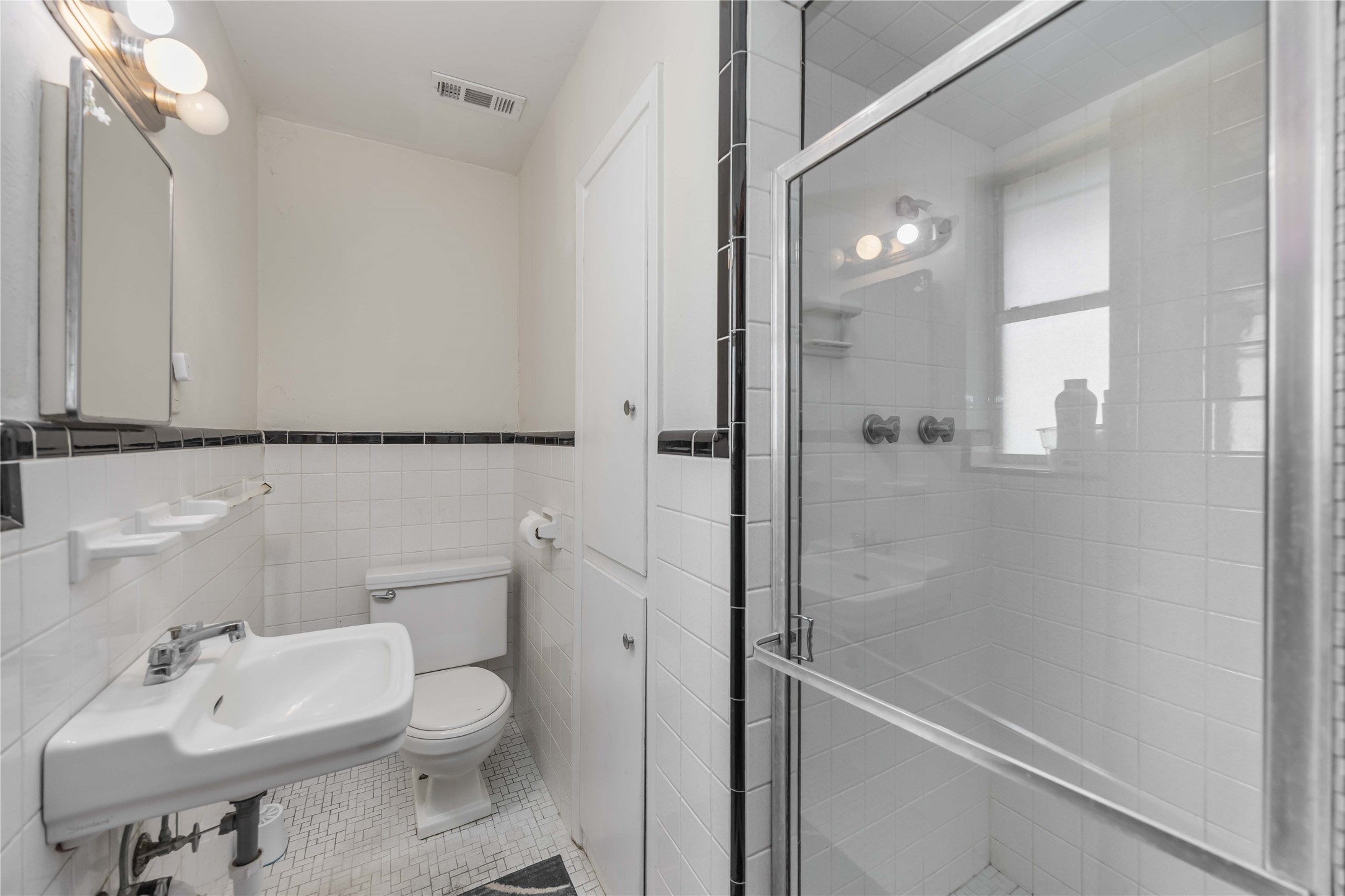 615 Massey Tompkins Road Baytown, TX 77521 - Photo 14 of 25 a bathroom with a sink a toilet and shower