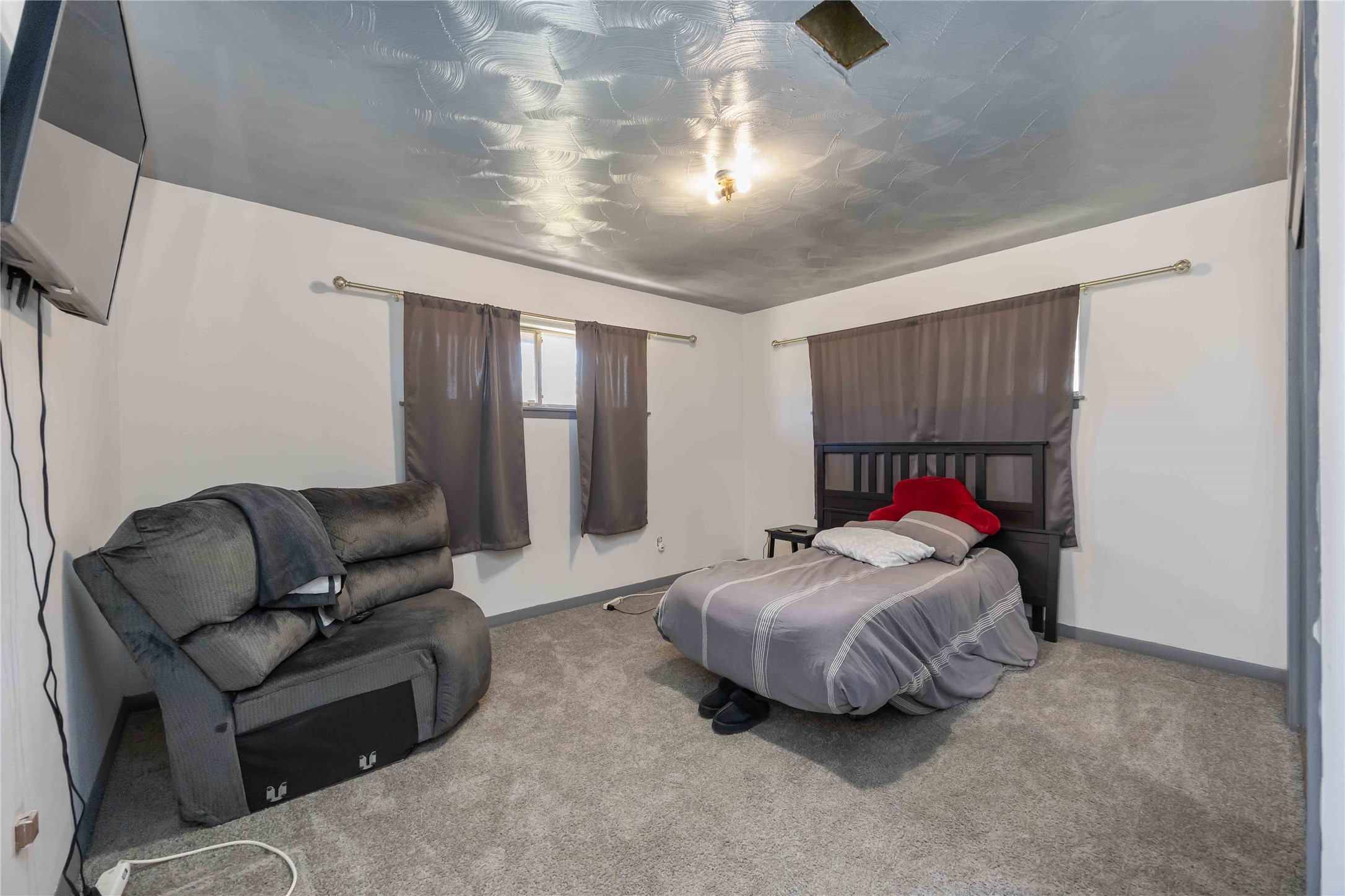 615 Massey Tompkins Road Baytown, TX 77521 - Photo 16 of 25 a living room with a bed and a couch