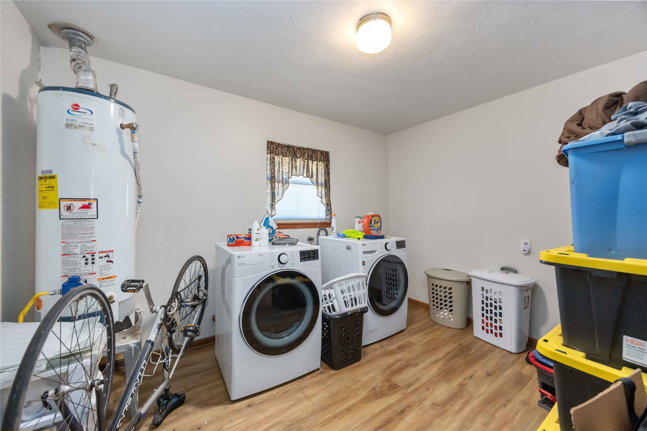 615 Massey Tompkins Road Baytown, TX 77521 - Photo 20 of 25 a utility room with dryer washer and a view of living room
