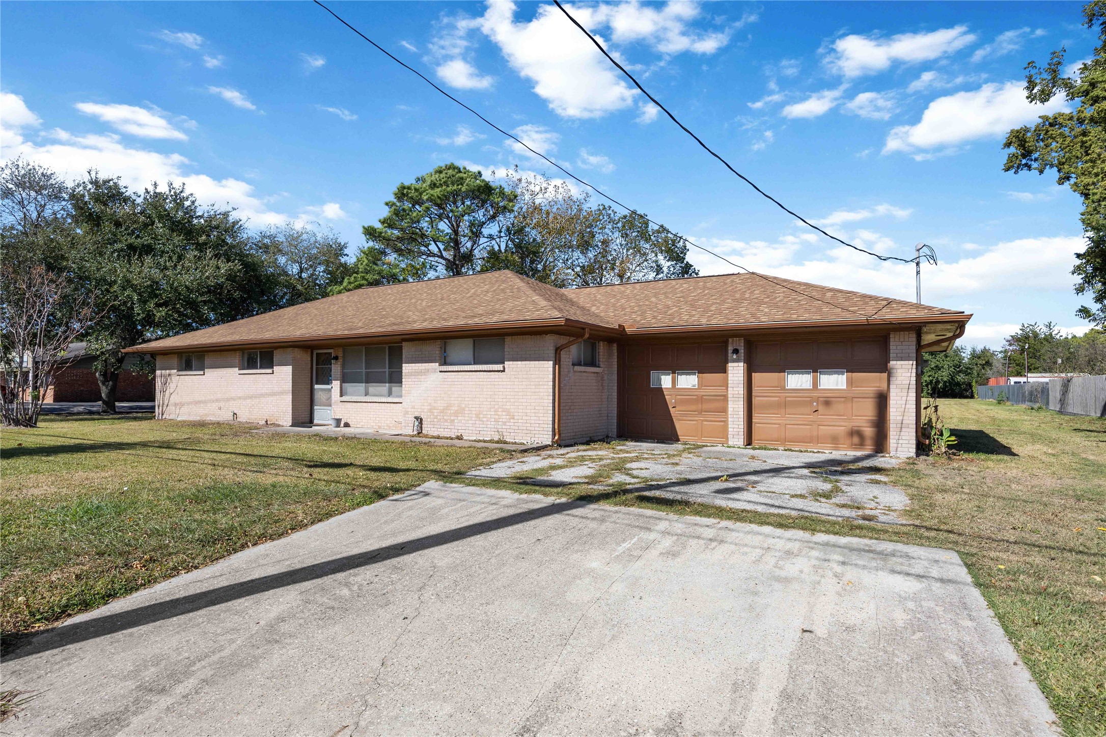 615 Massey Tompkins Road Baytown, TX 77521 - Photo 2 of 25 a view of a house with a yard and potted plants