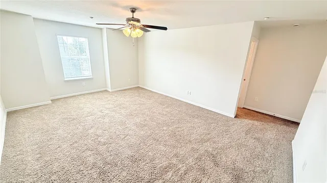 a view of a room with shelf on the wall