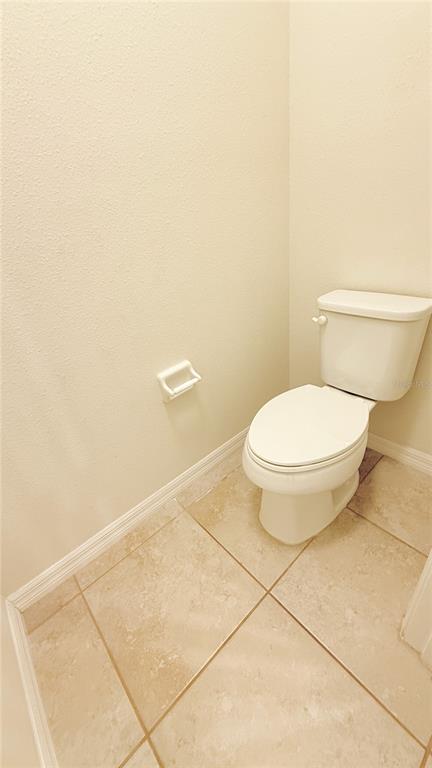 7580 Aloma Pines Court Winter Park, FL 32792 - Photo 16 of 36 a bathroom with a toilet and a vanity