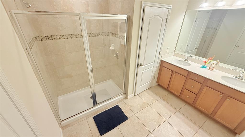 7580 Aloma Pines Court Winter Park, FL 32792 - Photo 17 of 36 a bathroom with a shower and a sink