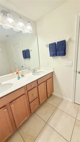 a bathroom with a sink a mirror and a vanity