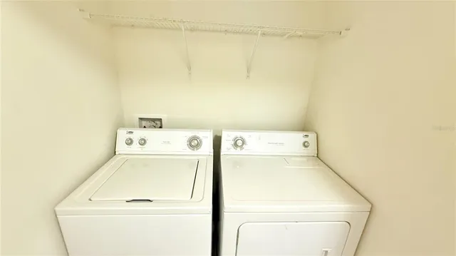 a view of a storage & utility room with a window