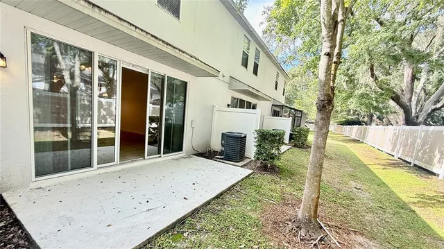 an aerial view of a house with a yard and garden