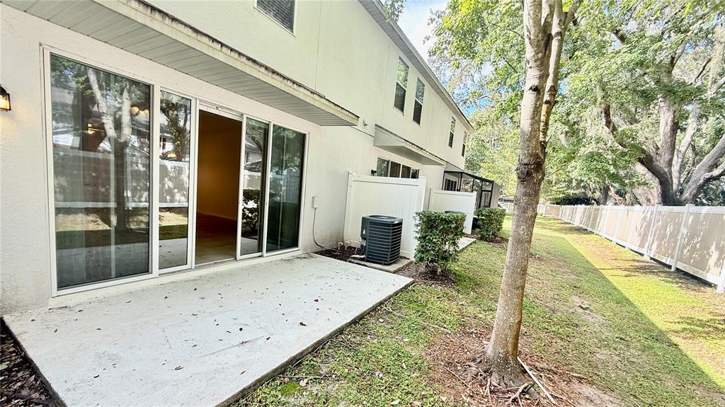 7580 Aloma Pines Court Winter Park, FL 32792 - Photo 31 of 36 a view of a house with backyard and sitting area
