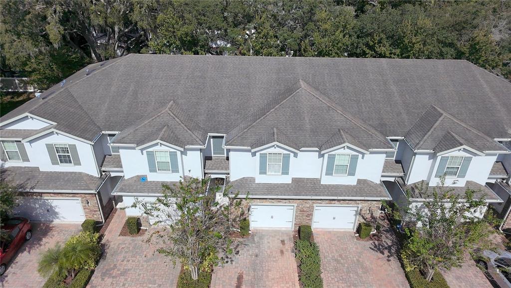 7580 Aloma Pines Court Winter Park, FL 32792 - Photo 32 of 36 an aerial view of a house with a yard and garden