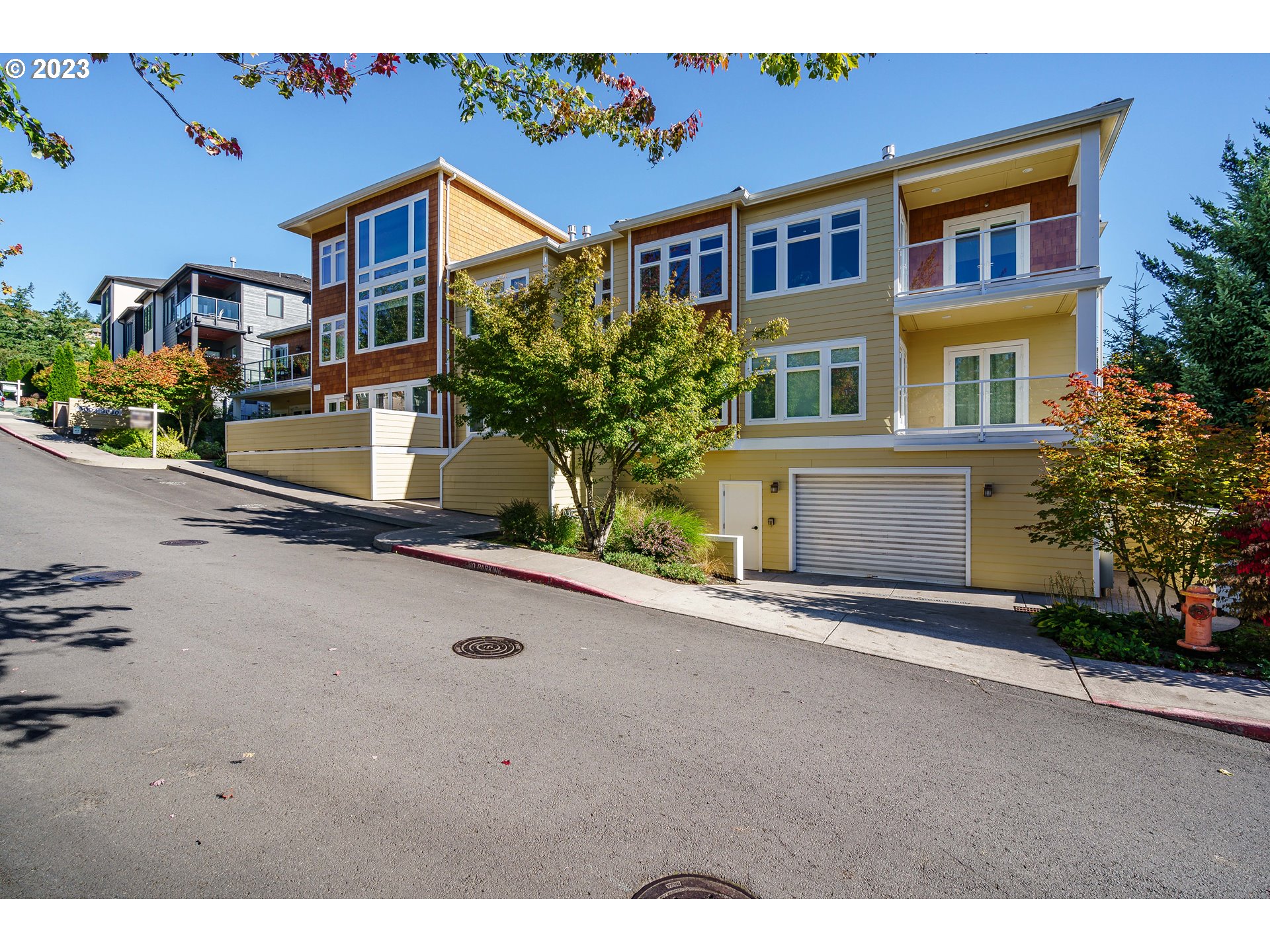 3030 Northwest Montara Loop Portland, OR 97229 - Photo 2 of 37 a front view of a house with a yard and garage
